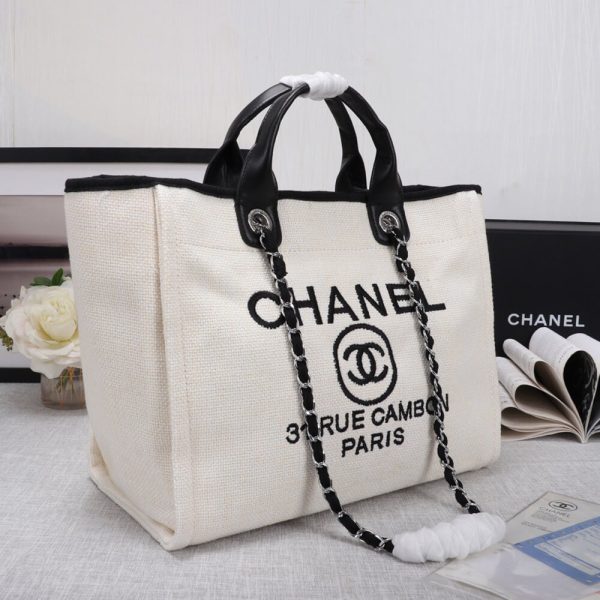 Ch*el woven straw raffia striped medium deauville tote